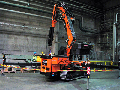 Articulated crane on tracks can access confined areas